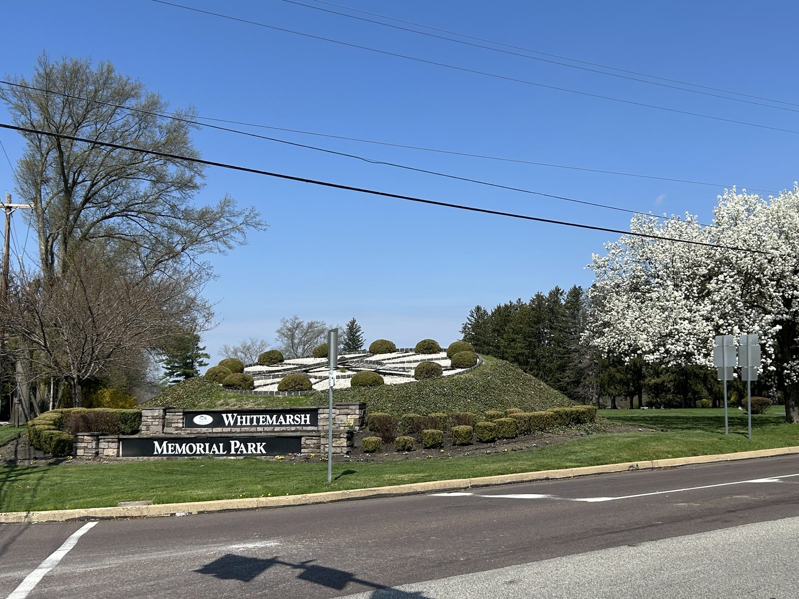 Whitemarsh Memorial Park entrance sign with the flower clock on Limekiln Pike